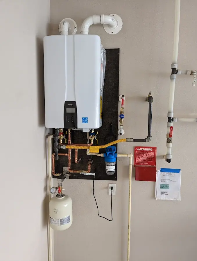 Professional plumber installing copper piping in a Myrtletown home